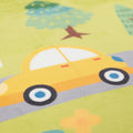 Children's play mat with a yellow car and green trees on a yellow background
