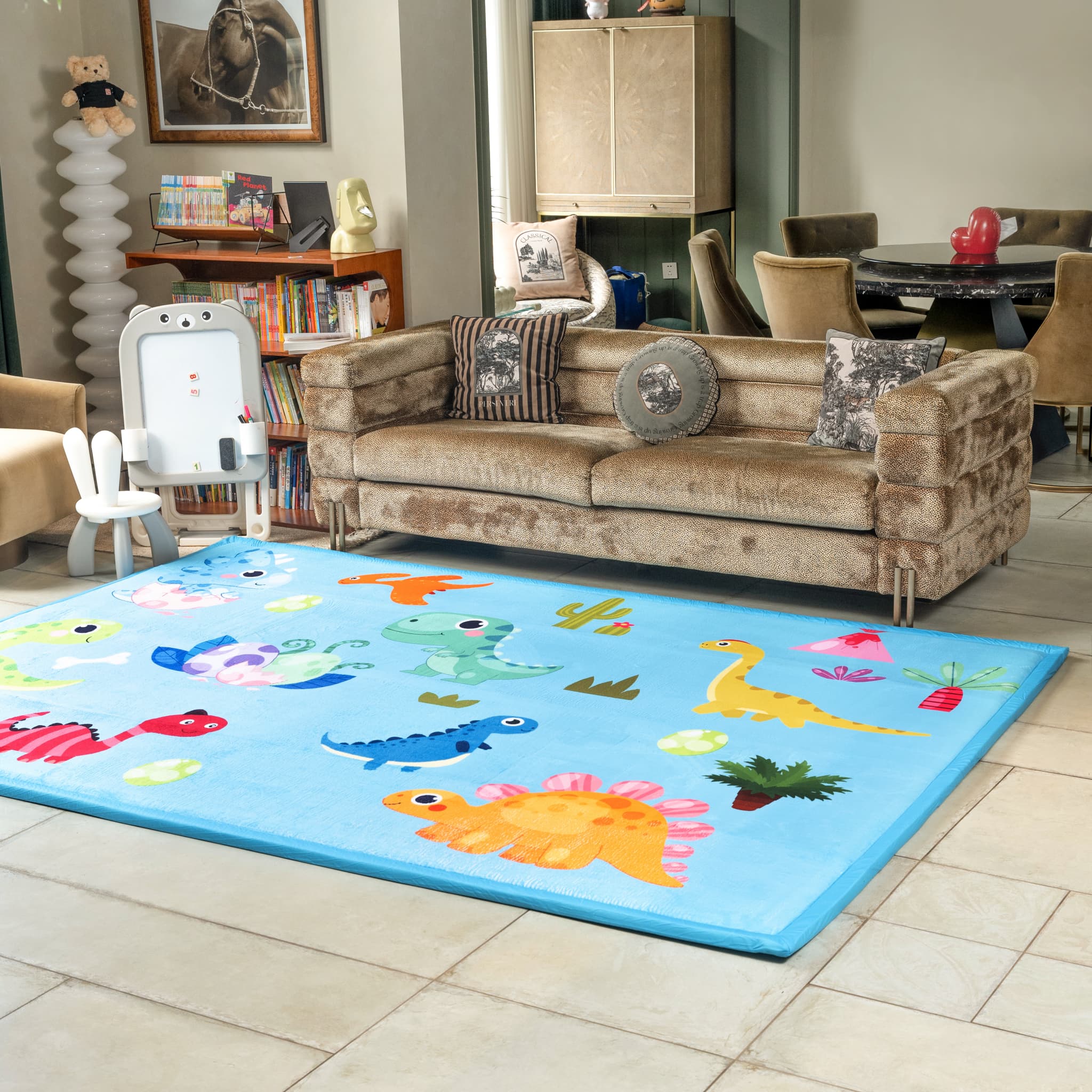 Children's room with a colorful rug featuring cartoon animals on a light wood floor.