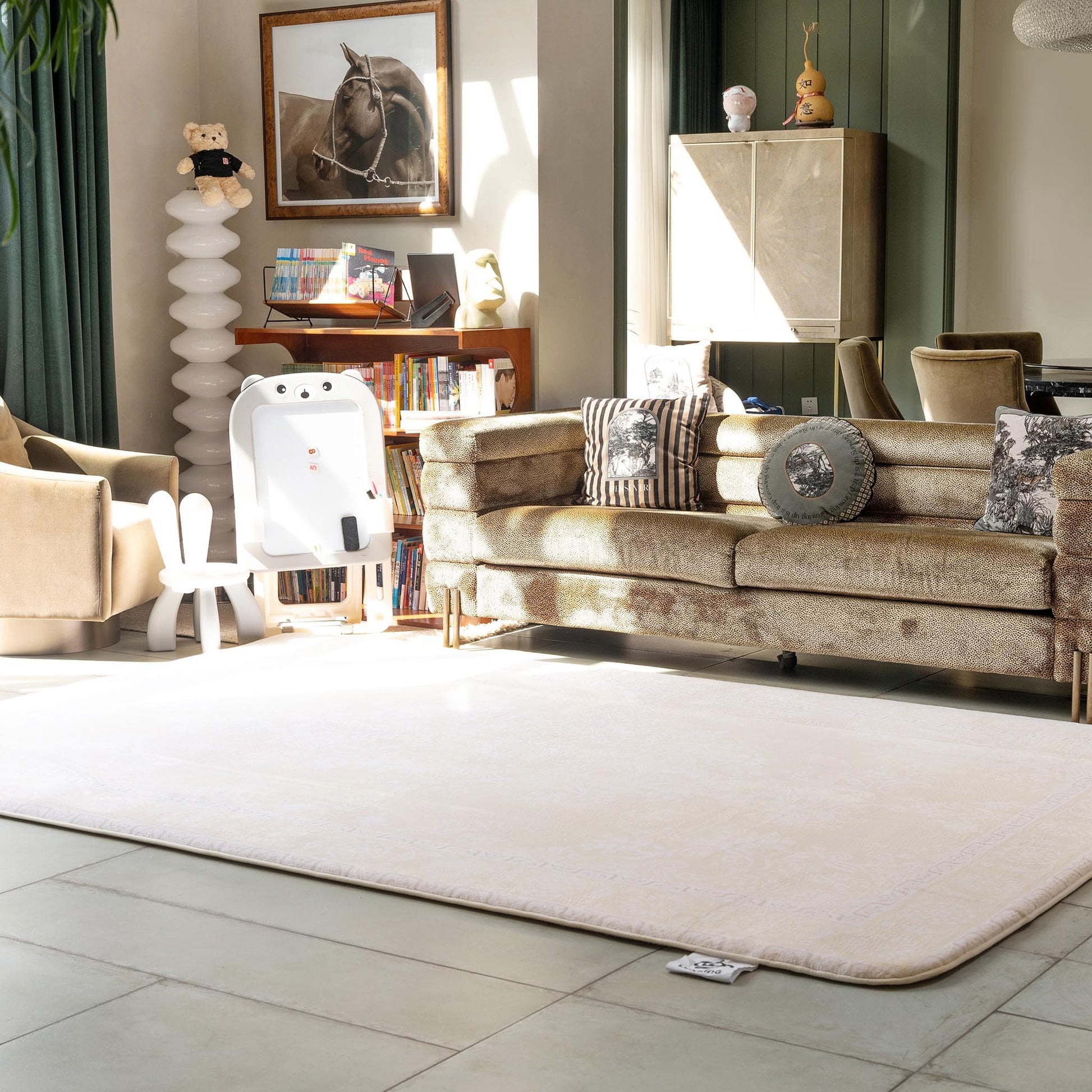 Living room with LuxKing Cloud Mat of Elegant Damask design and a beige sofa, armchair, and decorative items around it.