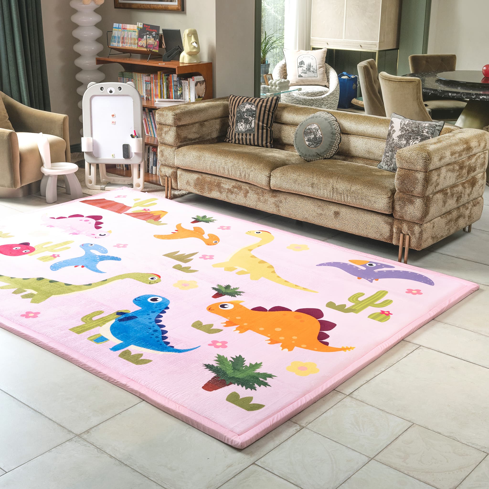 Living room with a dinosaur-themed rug on a tiled floor.