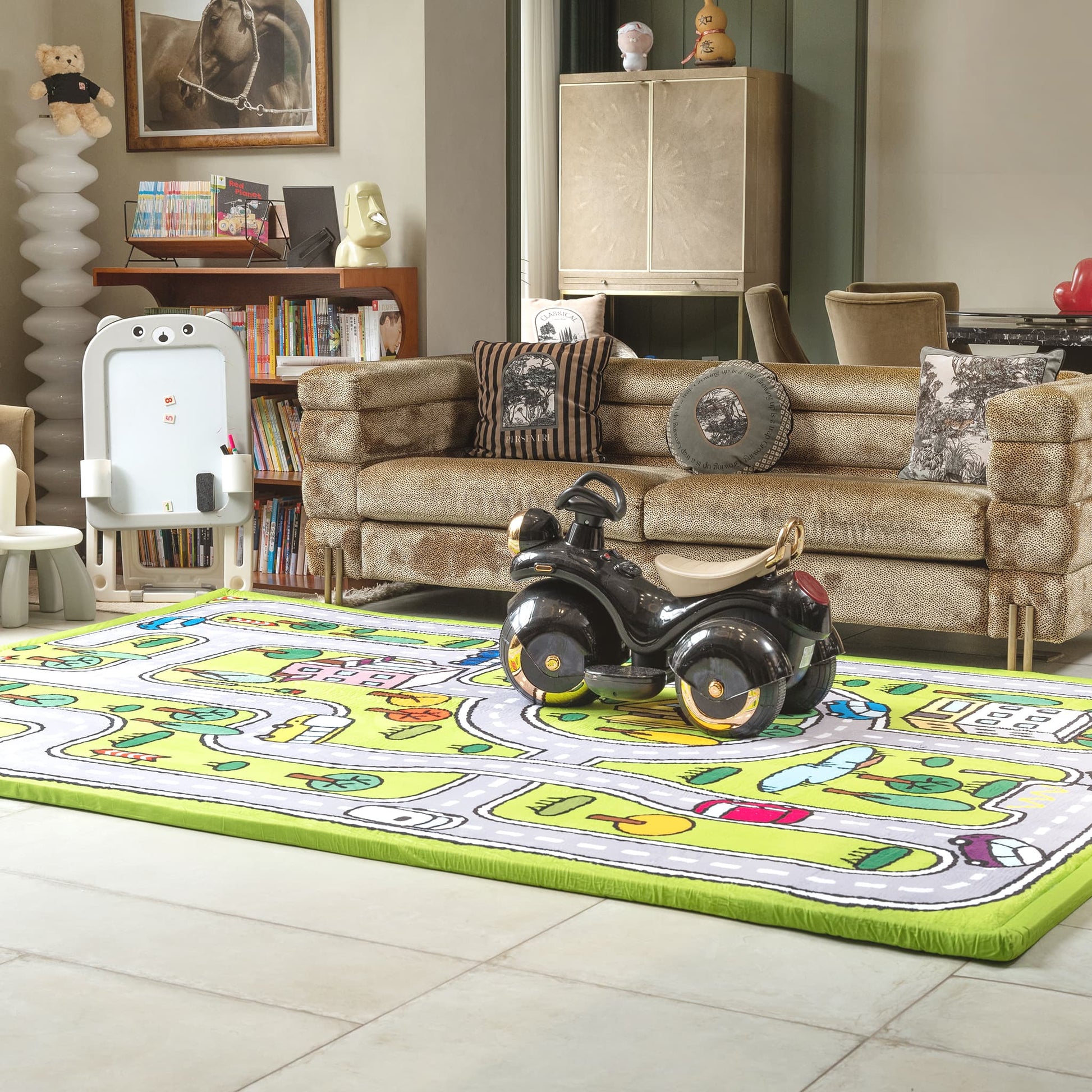 Children's room with a toy car on a colorful rug, books, and toys in the background.