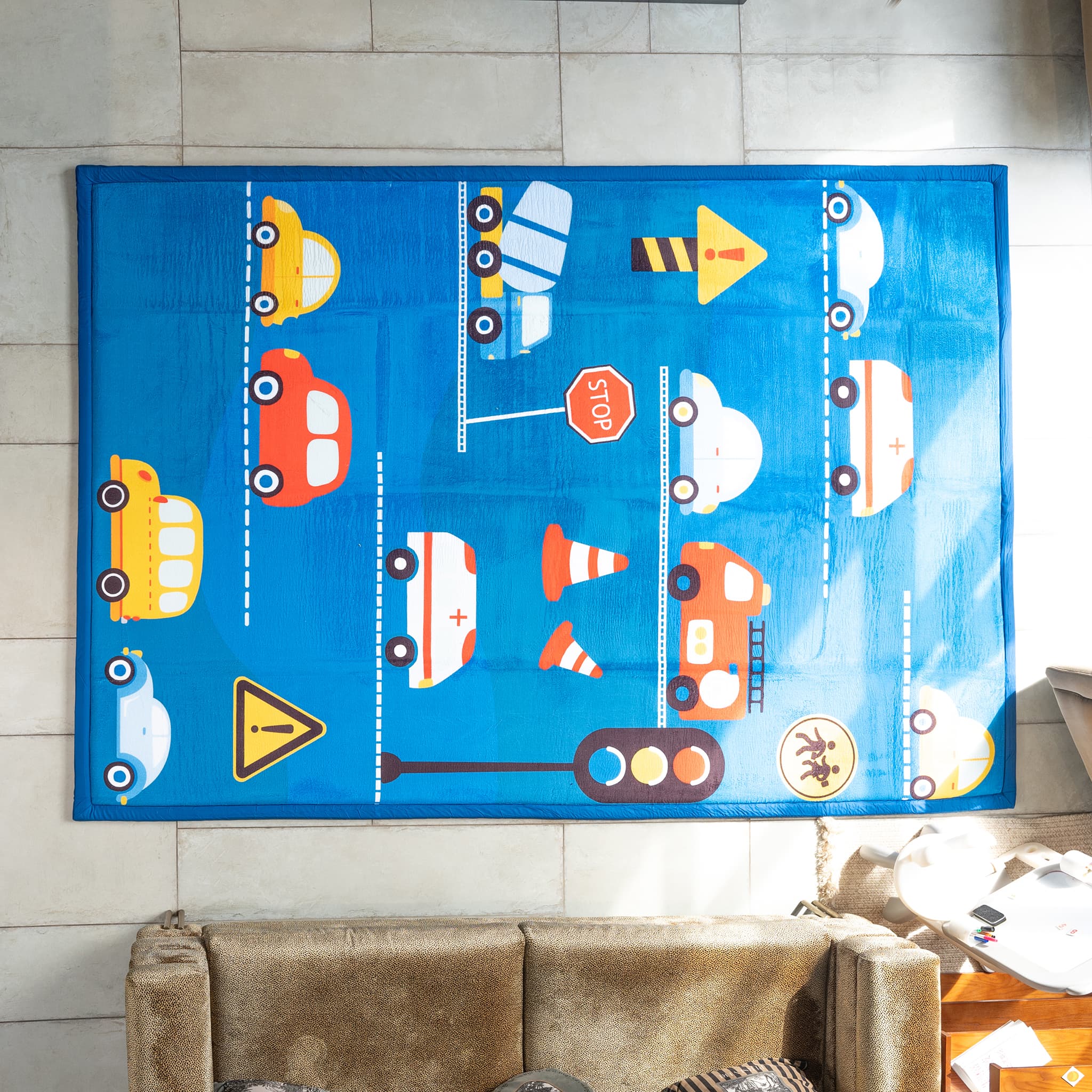 Children's play mat with vehicle patterns on a tiled floor