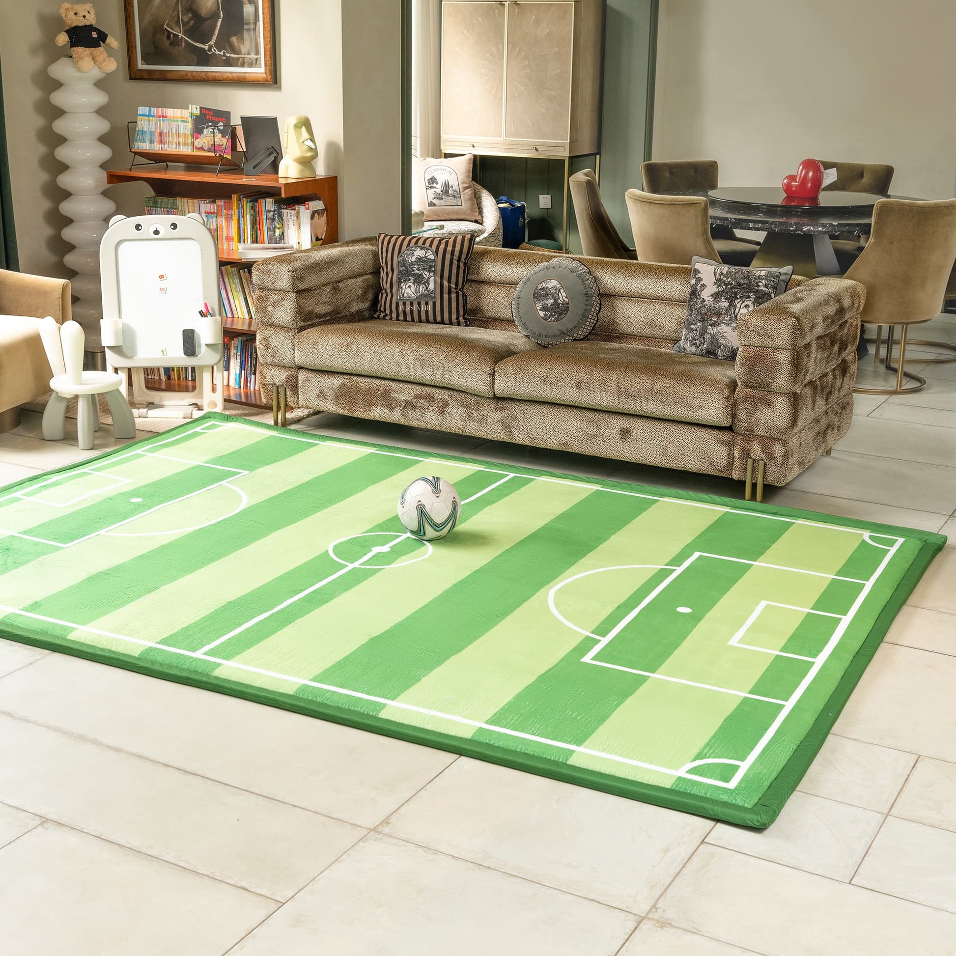 Living room with a soccer field rug and beige sofa