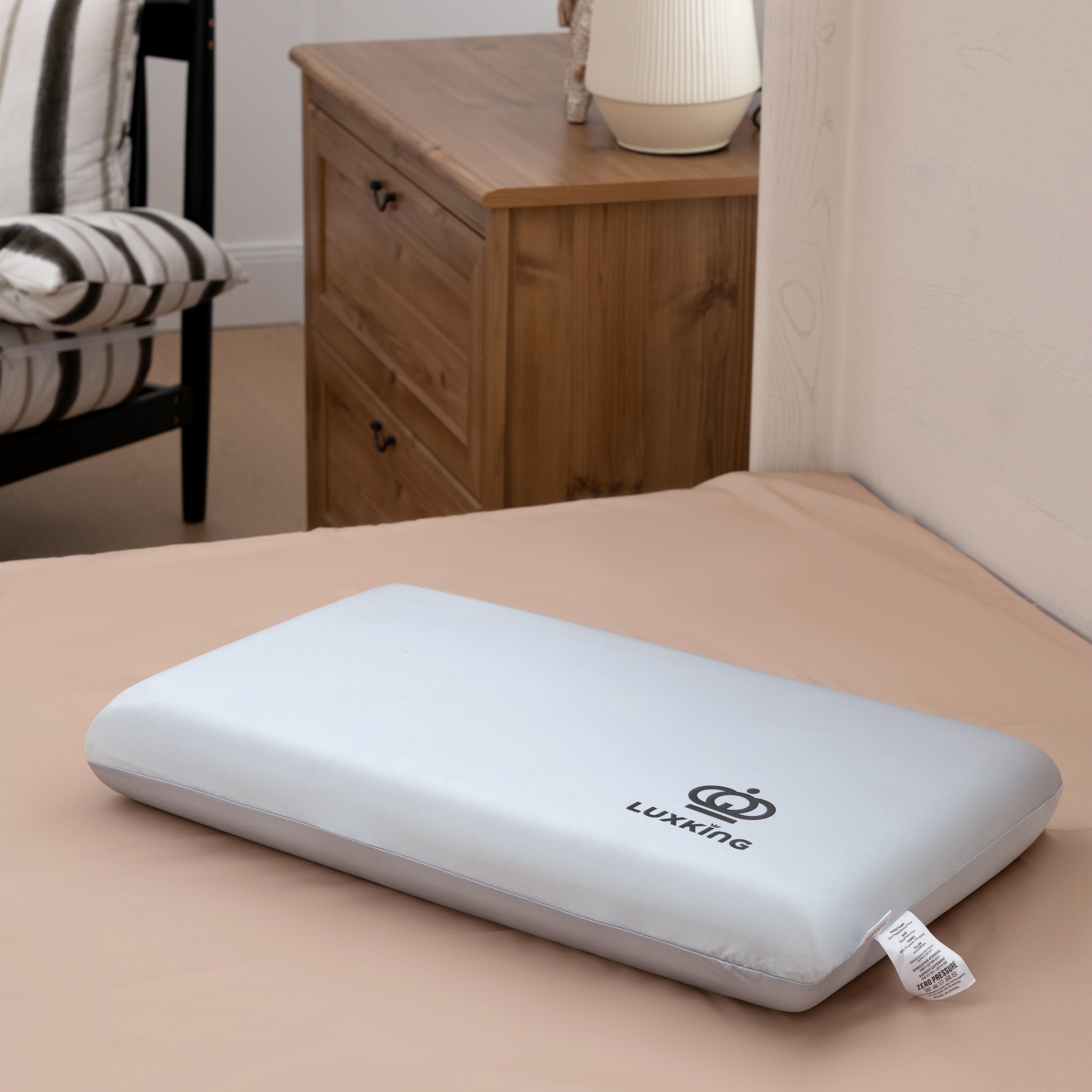 Luxking pillow on a bed in a bedroom setting