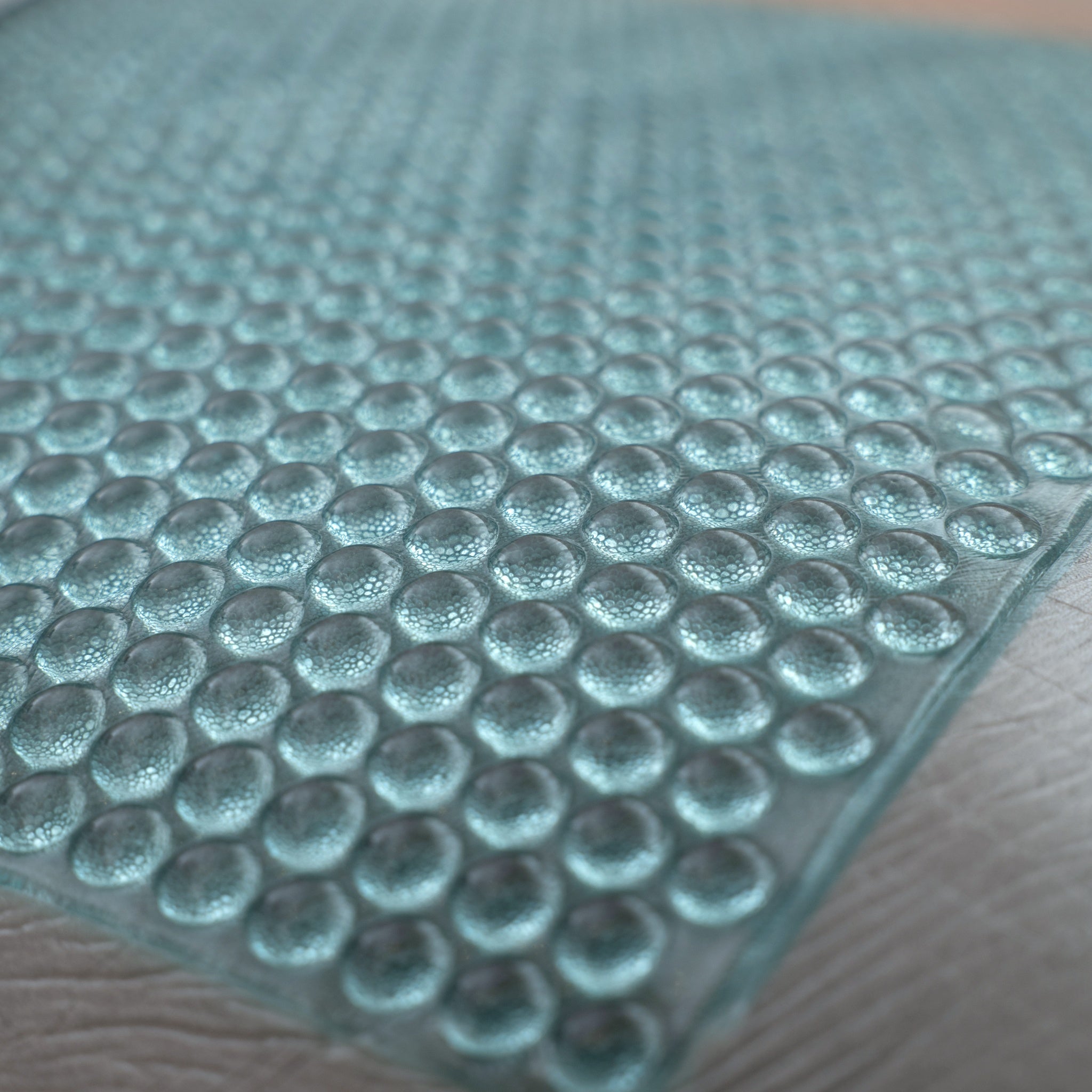 Close-up of a textured blue mat with circular patterns