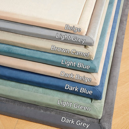 Stack of fabric swatches in various colors with labels on a wooden surface