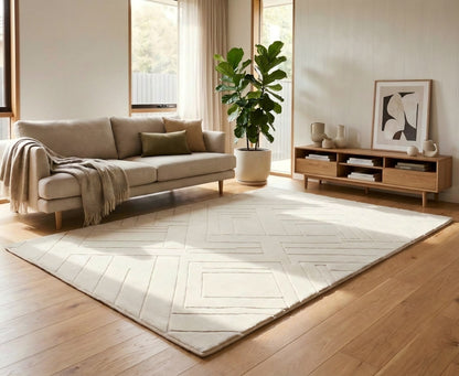 Modern living room with a beige sofa, rug, and wooden sideboard.