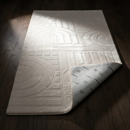 Textured bath mat on a wooden floor