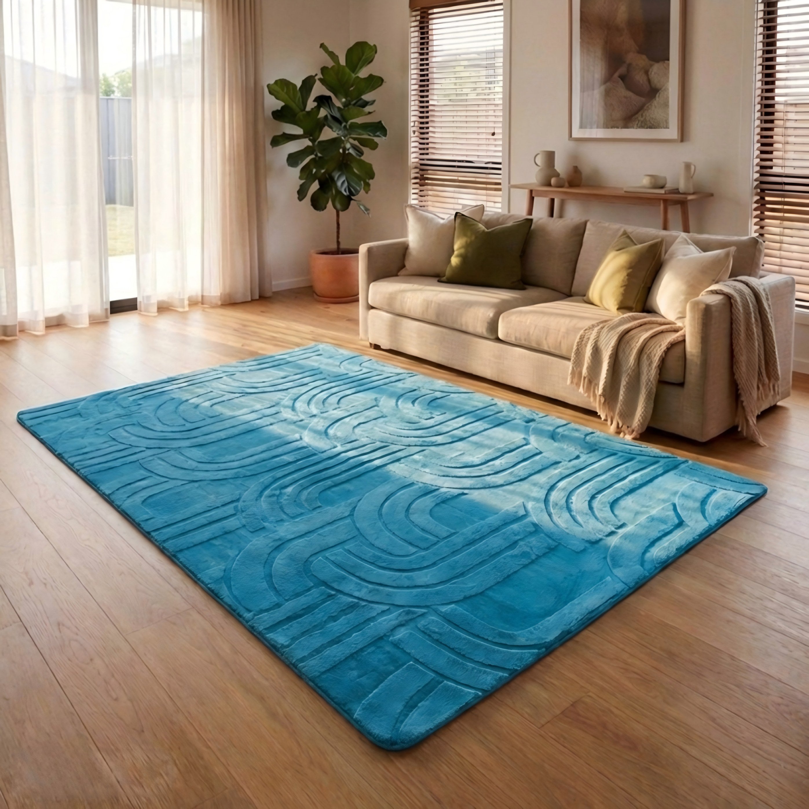 Blue textured rug on a wooden floor in a living room with a beige sofa and decorative items.