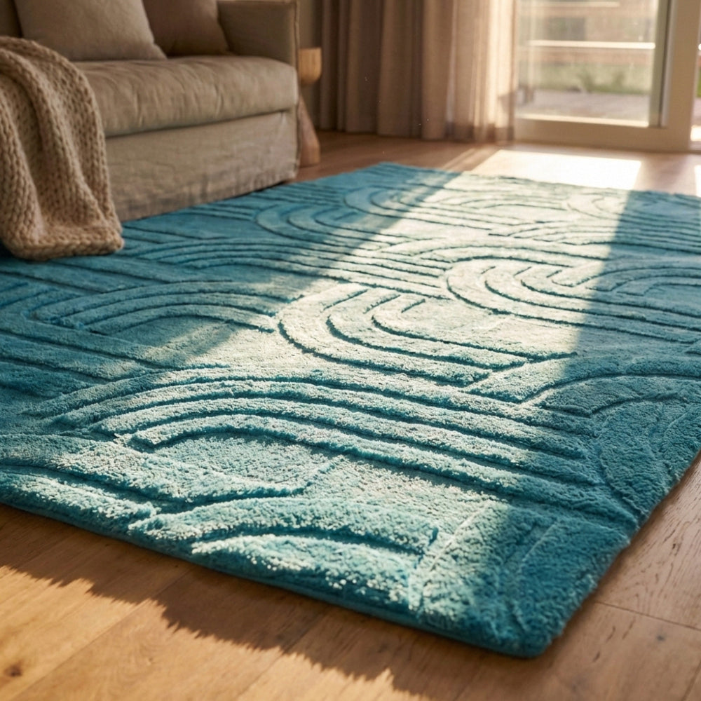 Teal textured rug on a wooden floor in a living room setting