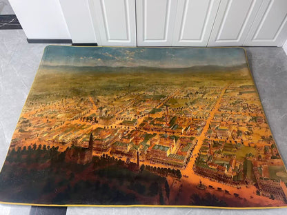 Decorative rug with an aerial cityscape design on a gray floor.