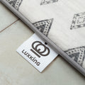 Luxking label on a rug with geometric pattern