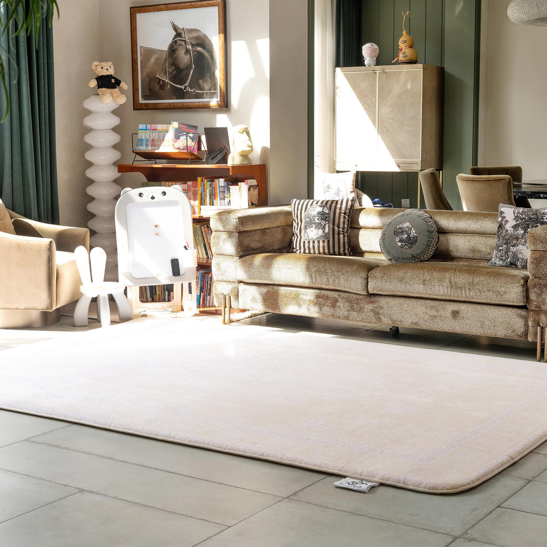 Living room with LuxKing Cloud Mat of Elegant Damask design and a beige sofa, armchair, and decorative items around it.