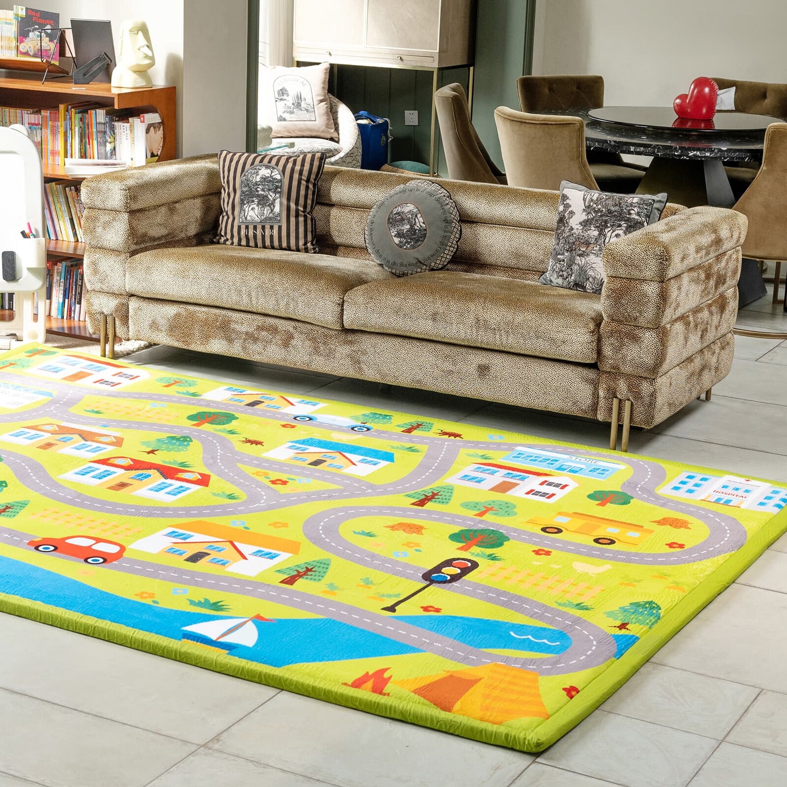 Living room with a beige sofa and a colorful children's cloud mat featuring roads and vehicles.