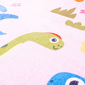 Children's play mat with colorful dinosaur design on a pink background
