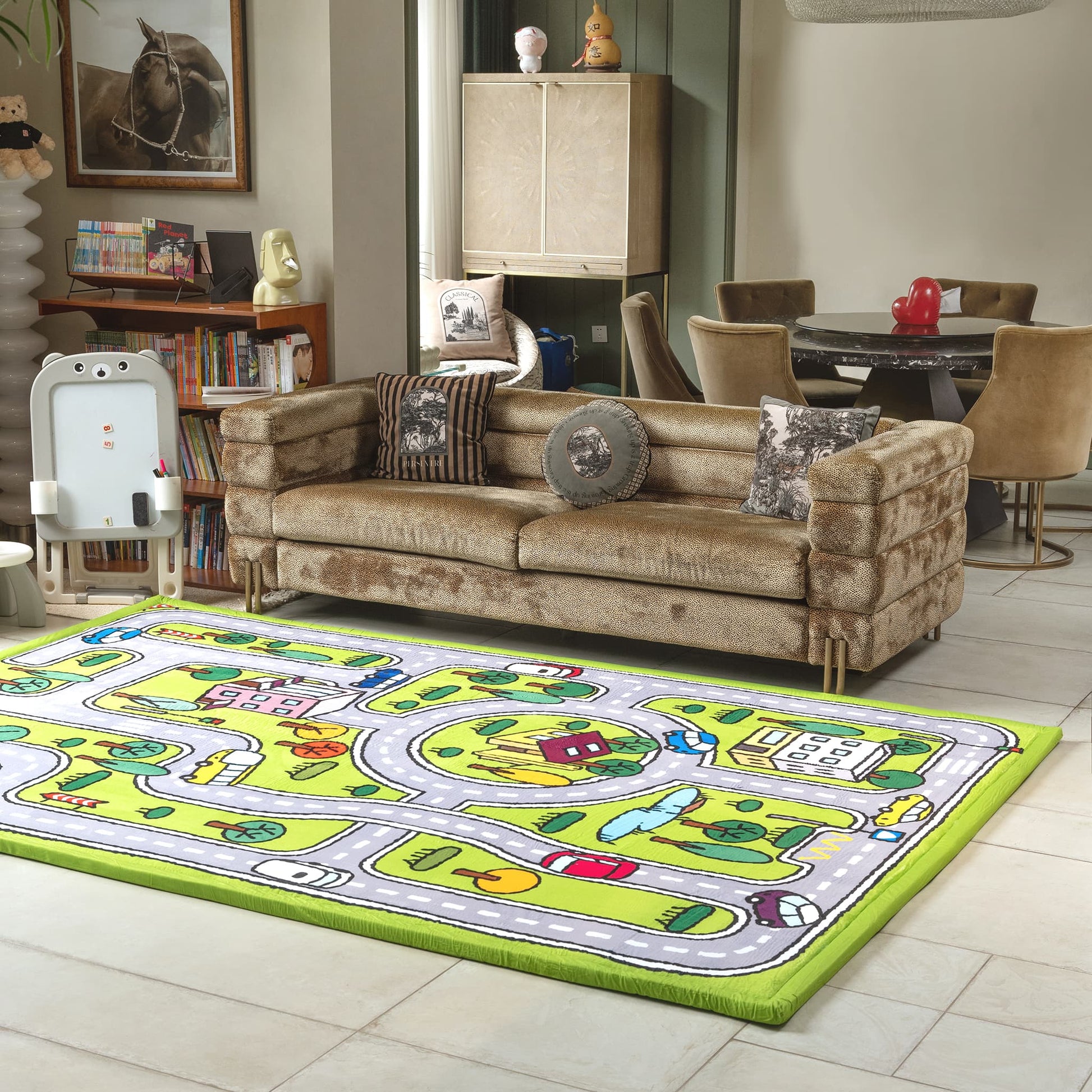 Living room with a brown sofa and a colorful children's play rug on the floor.