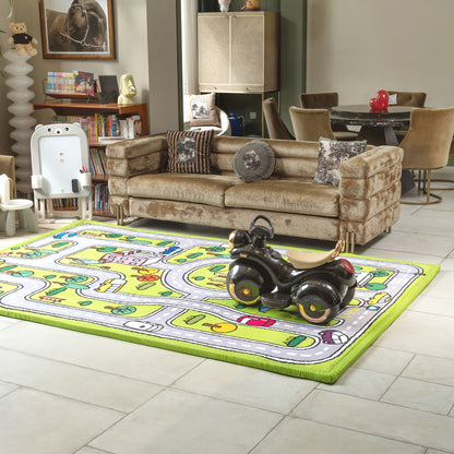 Living room with a child's play rug featuring road markings and a toy car, with a sofa and books in the background.