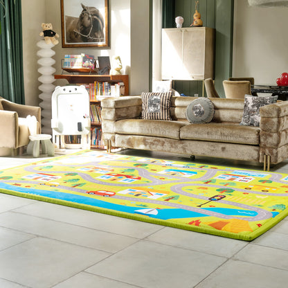 Living room with a colorful children's rug featuring roads and vehicles on a tiled floor.