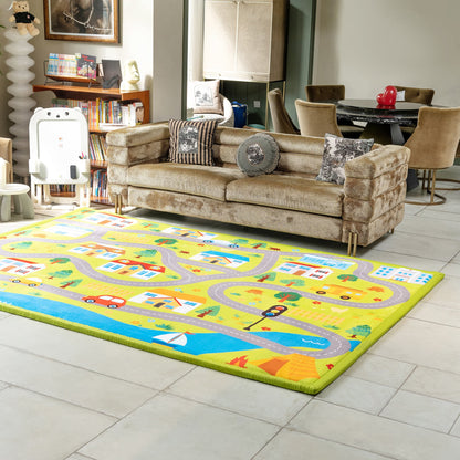 Living room with a colorful children's rug featuring roads and vehicles, a beige sofa with patterned cushions, and a bookshelf.