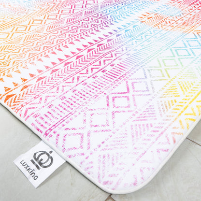 Colorful patterned rug with geometric designs on a light surface, featuring the brand 'Lukking'.