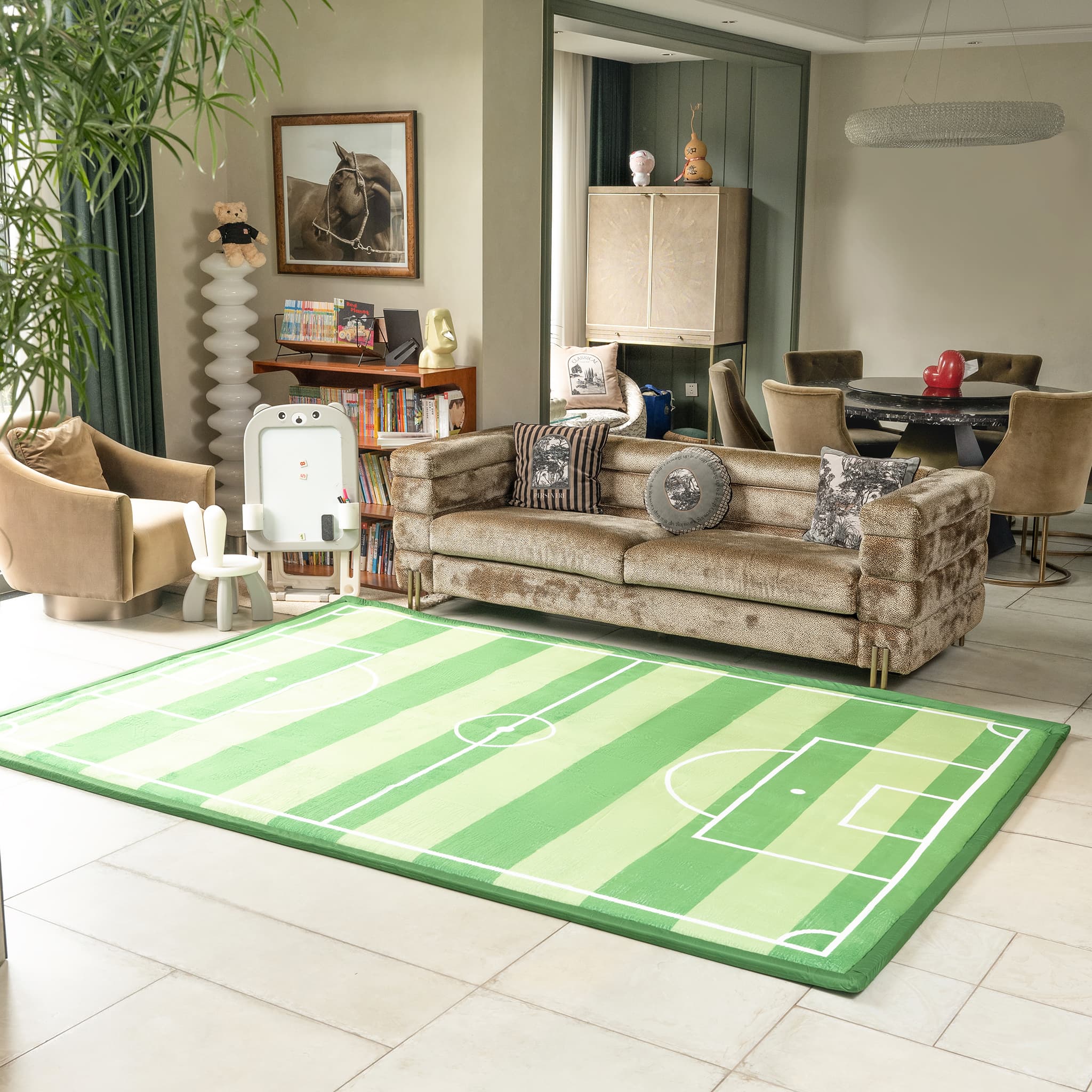 Living room with a green and white sports field rug, beige sofa, and decorative items.