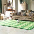 Living room with a green sports-themed rug, brown sofa, and decorative items.