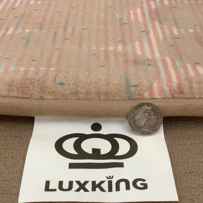 Luxking logo with a coin and paper on fabric background
