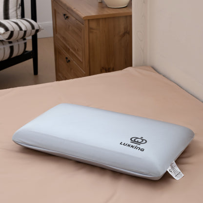 Gray pillow with Luxking logo on a bed in a bedroom setting