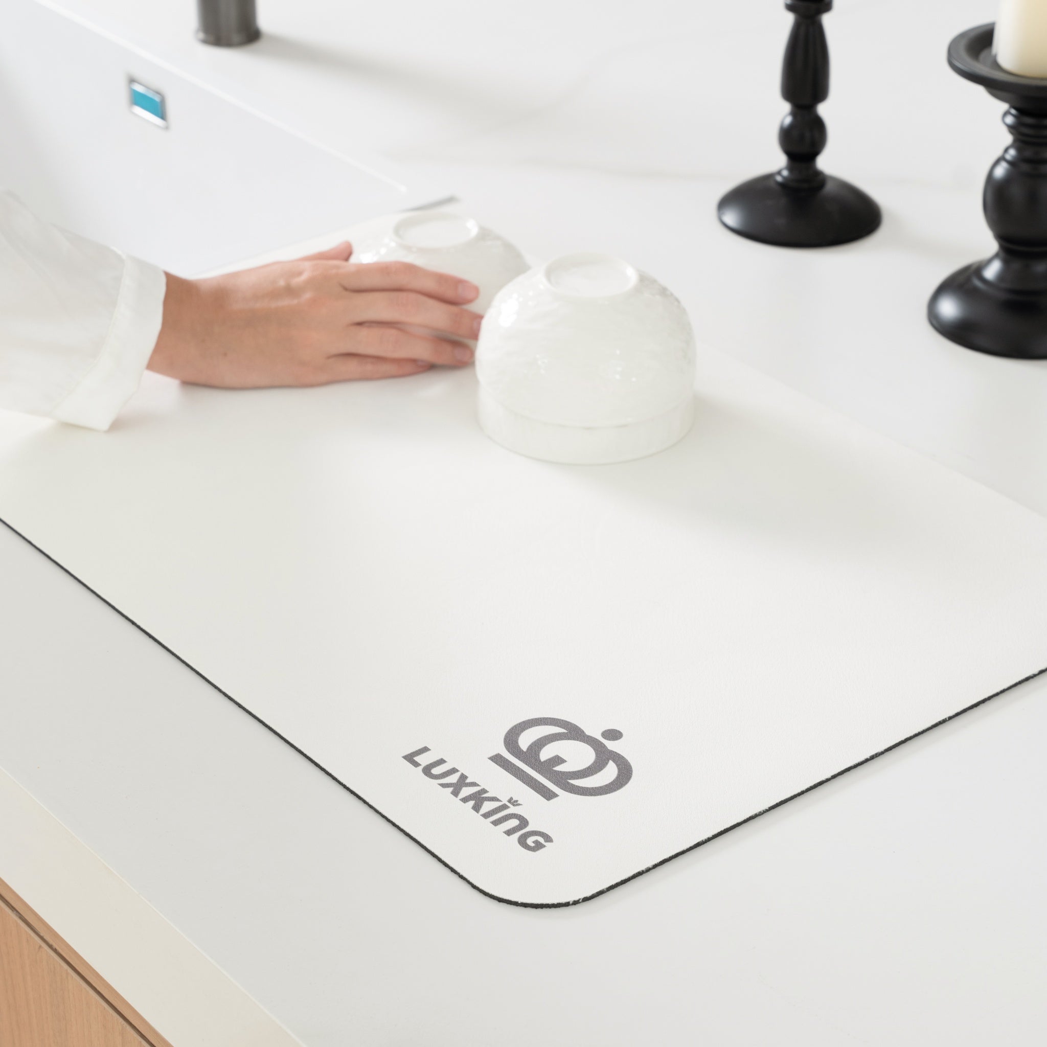 White desk mat with 'Luxking' logo on a desk surface.