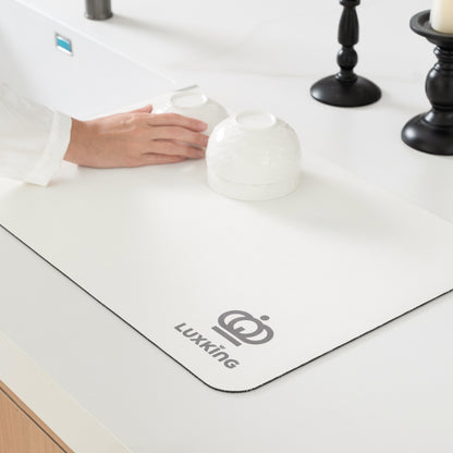 White desk mat with 'Luxking' logo on a desk surface.