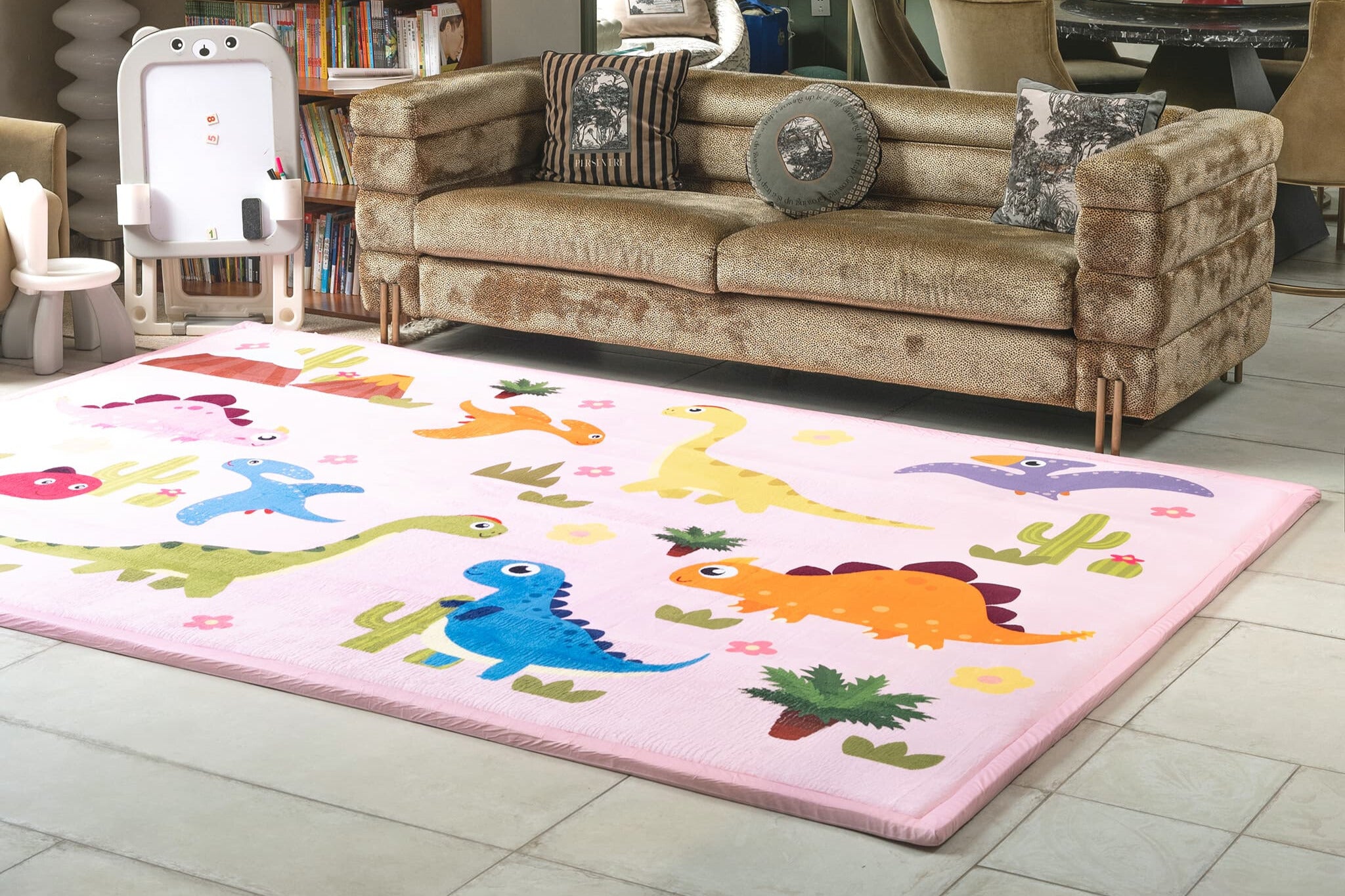 Children's room with a dinosaur-themed rug on the floor.