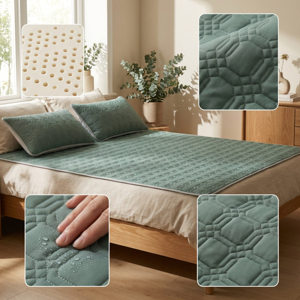 Bed with green quilted mattress cover and close-up details in a bedroom setting.